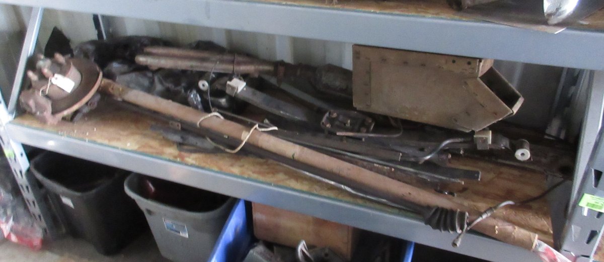 Group of auto parts on shelf