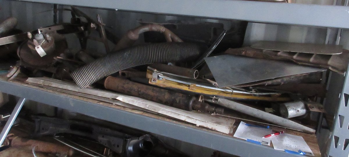 Group of auto parts on shelf