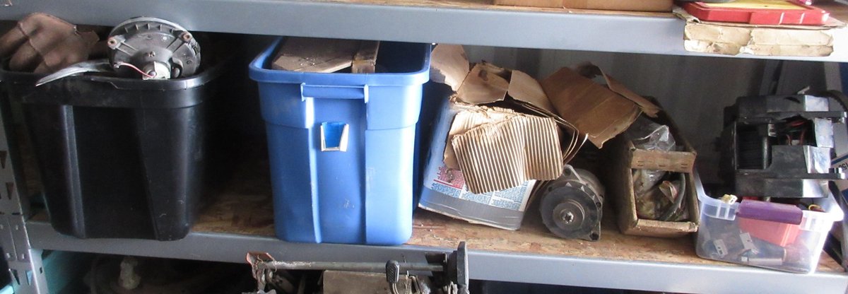 Group of auto parts on shelf