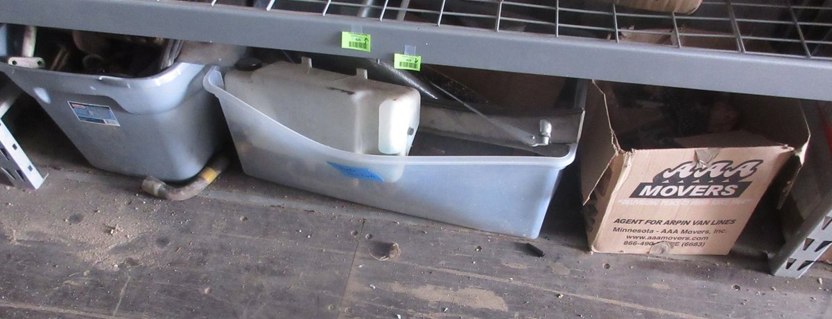 Group of auto parts on floor