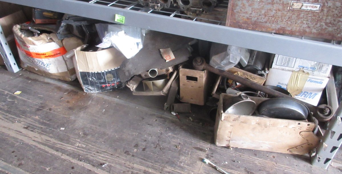 Group of auto parts on floor