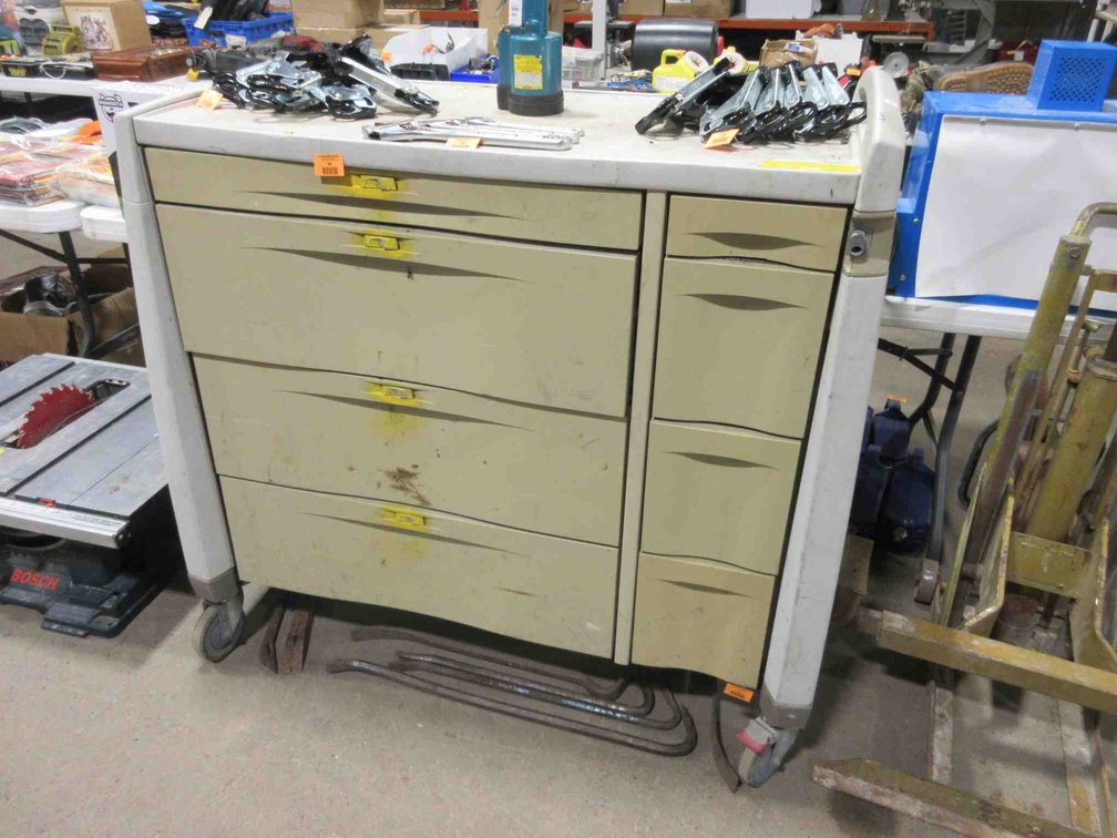 Plastic rolling cabinet with remaining contents