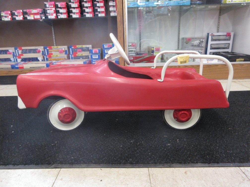 Pressed steel pedal car