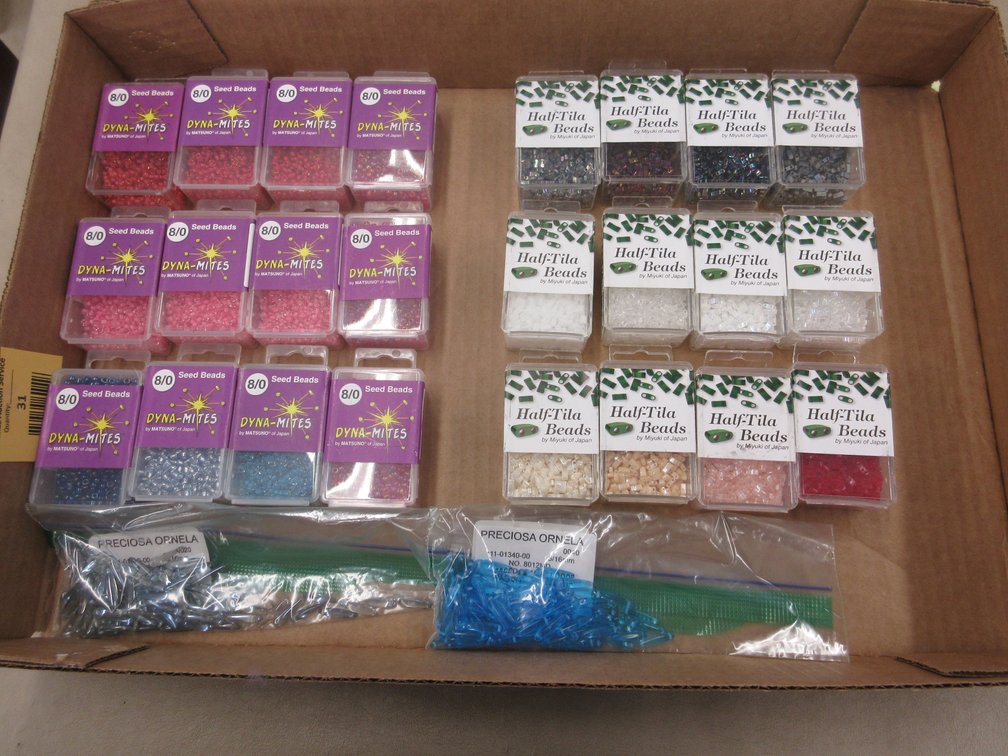 Box of Half-Tila beads and Dyna-Mites seed beads in packages