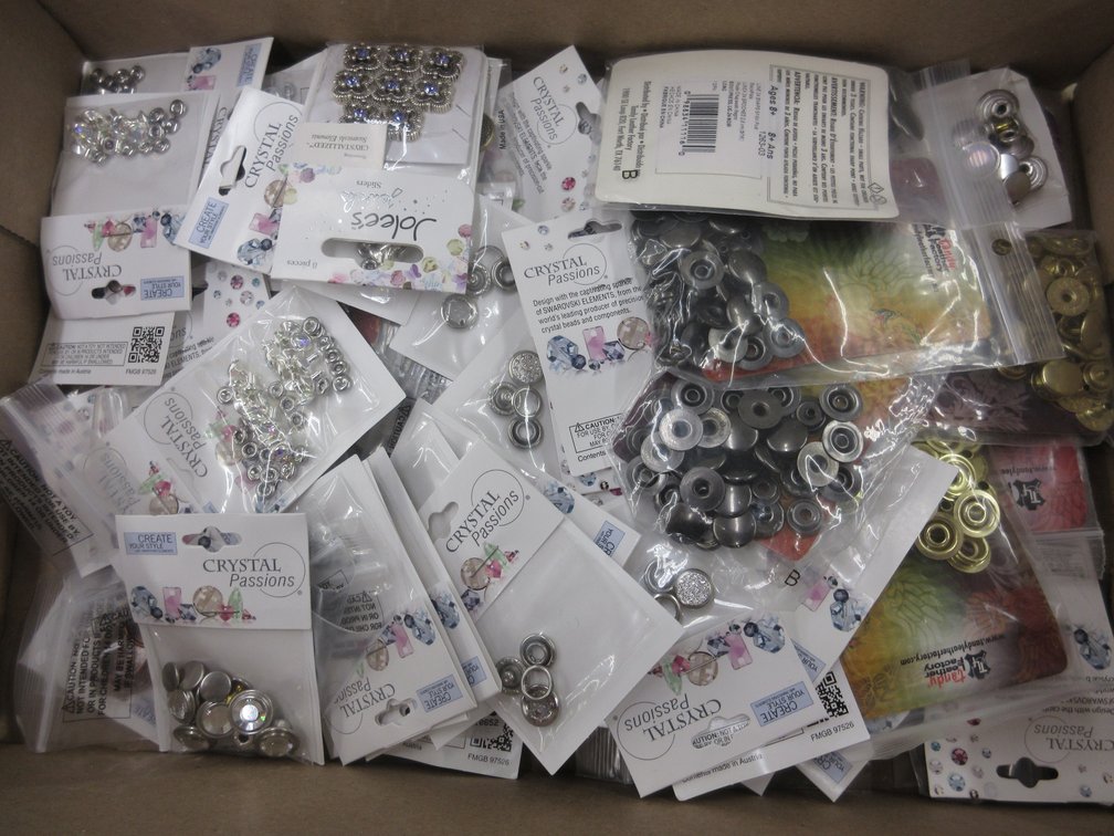 Box of jewelry-making snaps