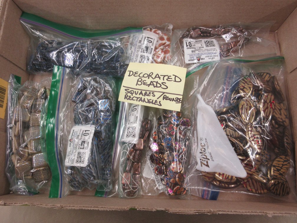 Box of decorated glass beads for jewelry-making