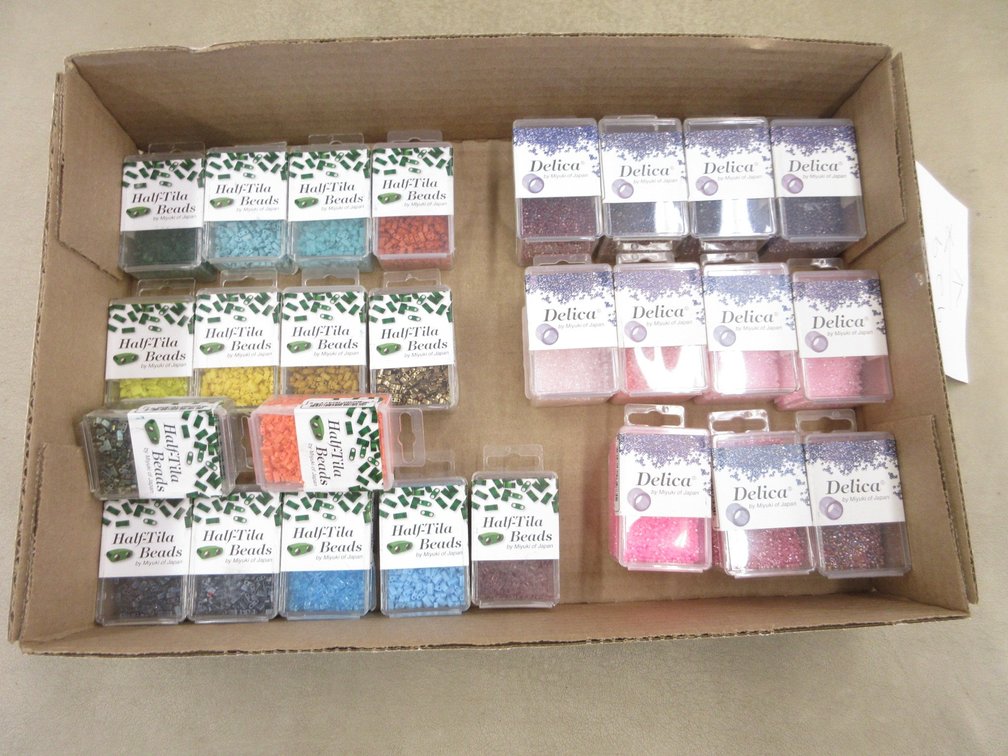 Box of packages of beads for jewelry-making, all sealed