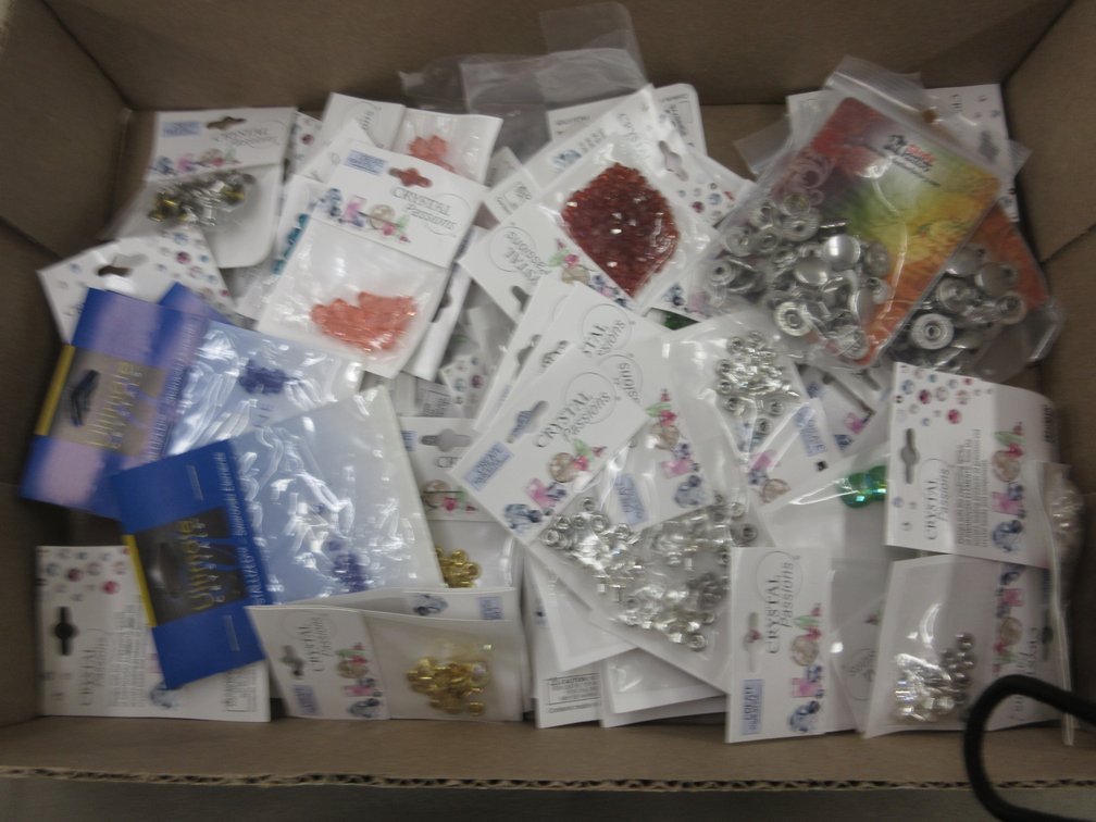 Box of jewelry making snaps, beads, and press studs