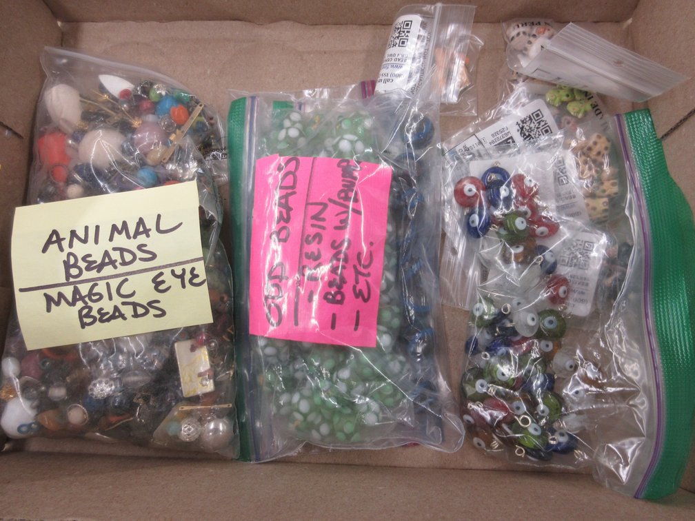 Box of unique glass and resin beads