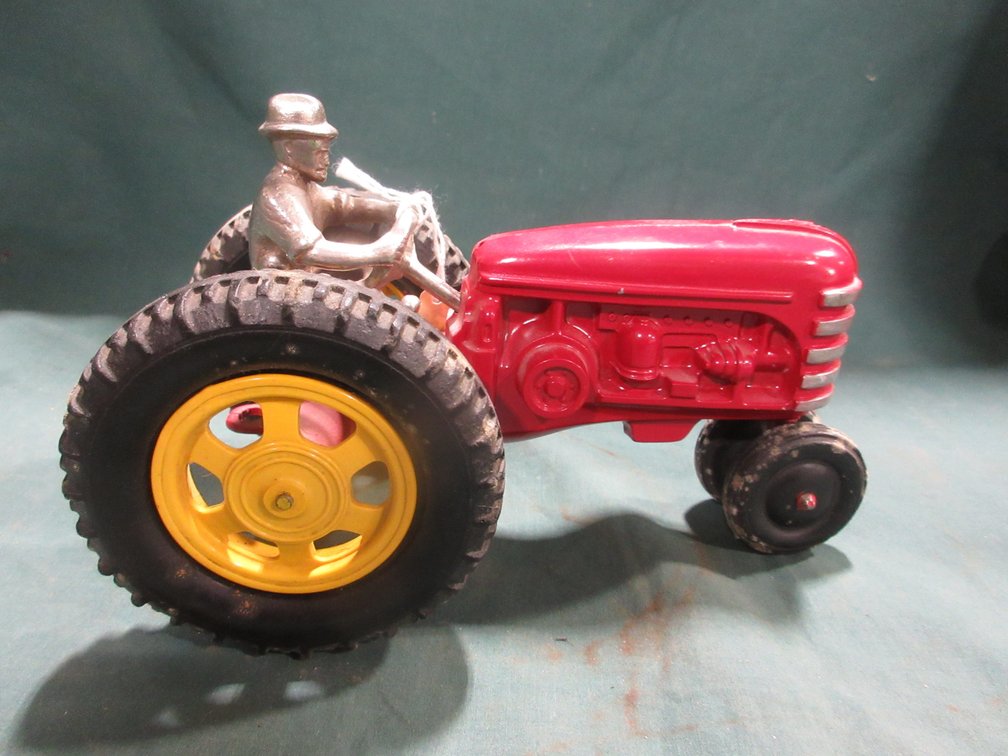 Cast metal tractor with driver