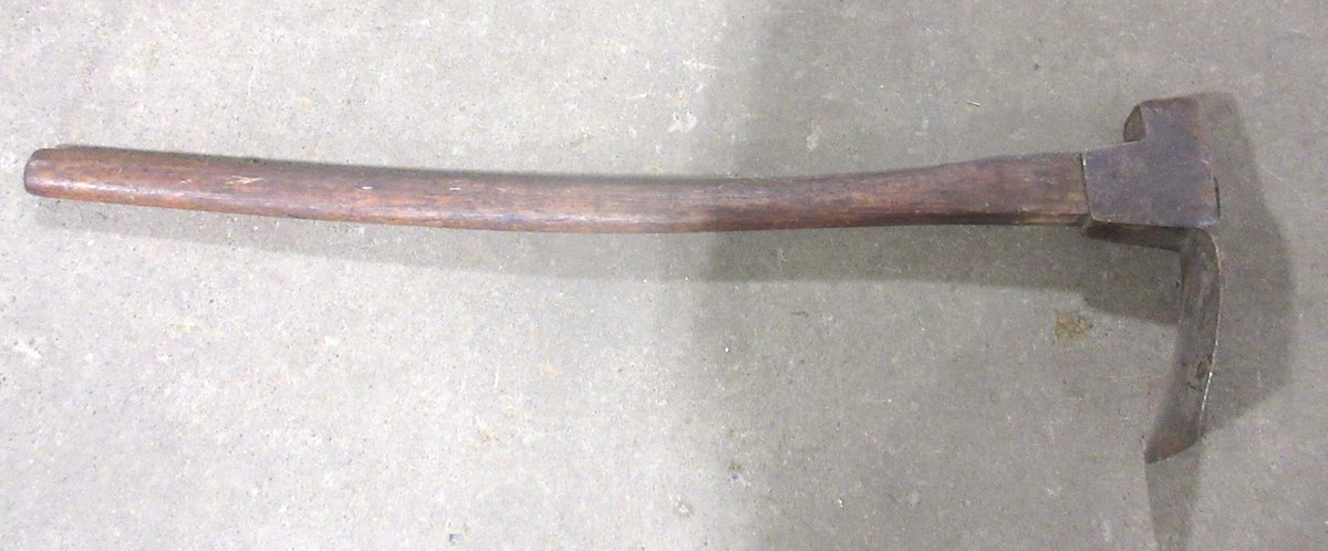 Antique adze with wood handle