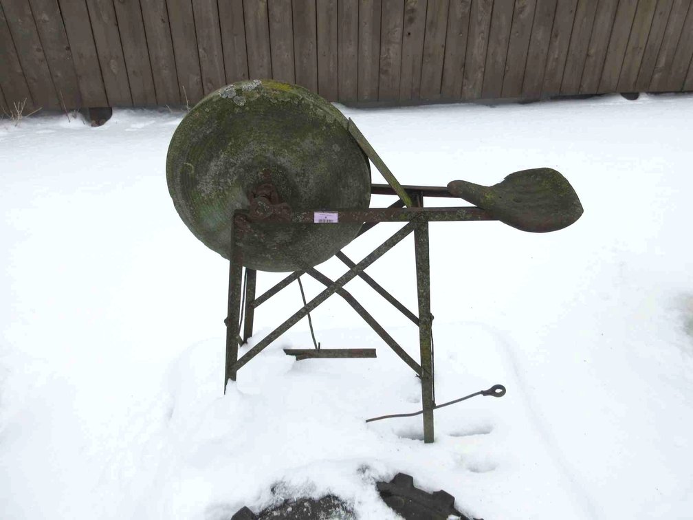 Grinding stone on metal stand