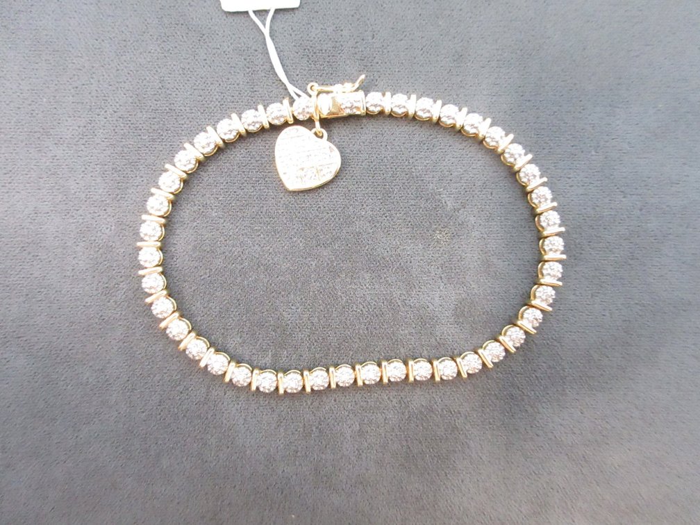 Gold tone sterling silver bracelet with heart charm