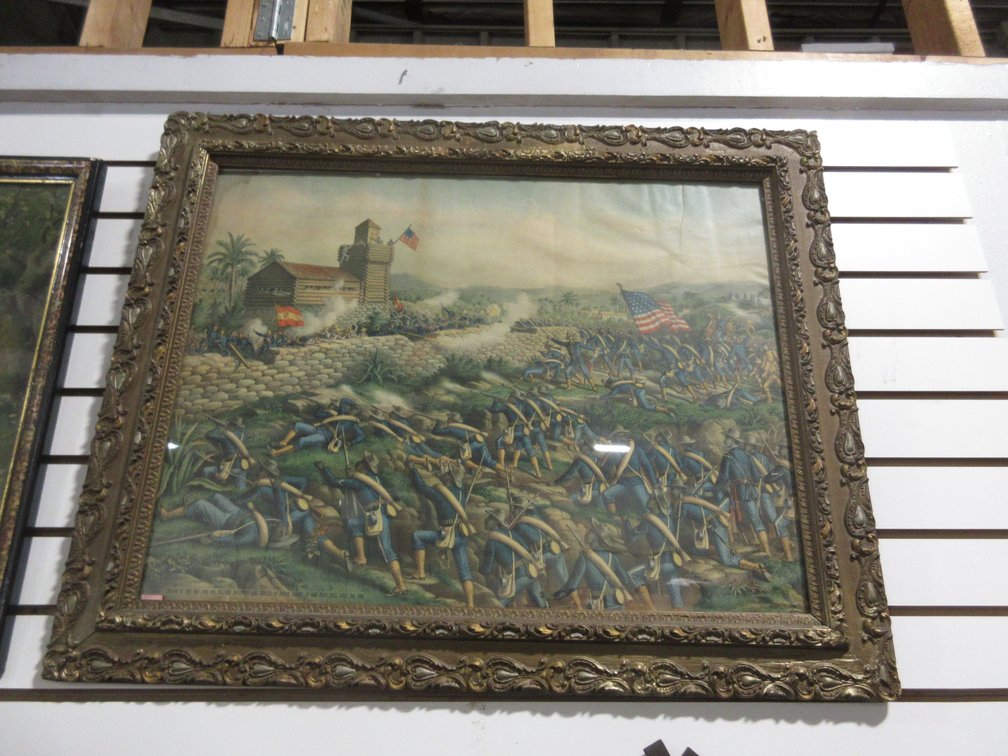 Antique framed picture of "Charge of the 24th and 25th colorized Infantry and rescue of The Rough Riders at San Juan Hill, July 2nd 1898