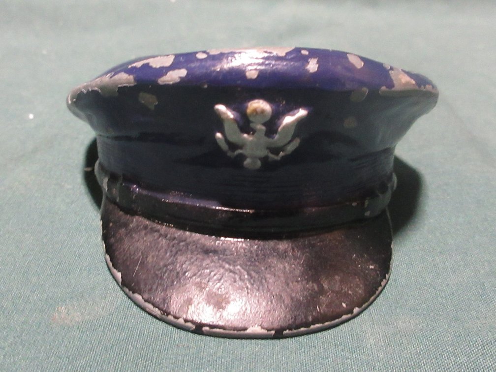 Cast metal Police hat marked "Irwin Skiba Irvington NJ"