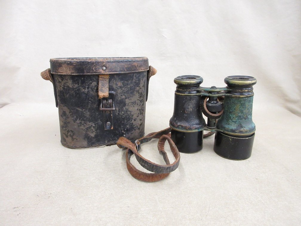 Antique binoculars in leather case