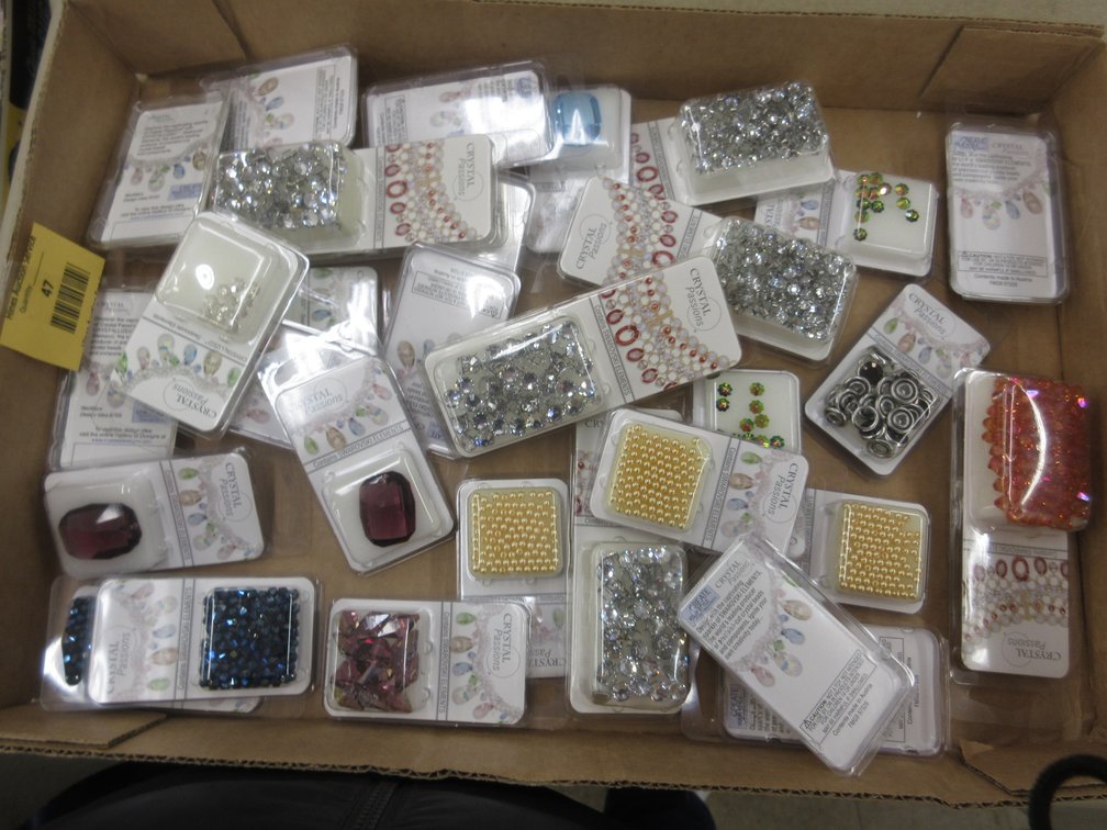 Box of Crystal Passions Swarovski Element jewelry-making beads, snaps, and large jewels