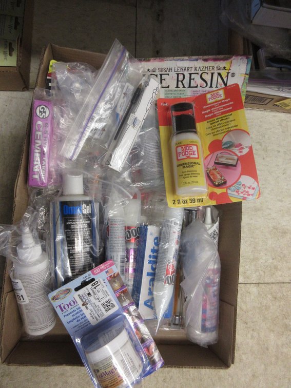 Box of jewelry-making adhesives