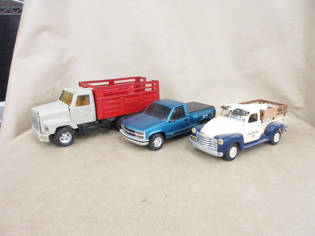 (3) Toy trucks