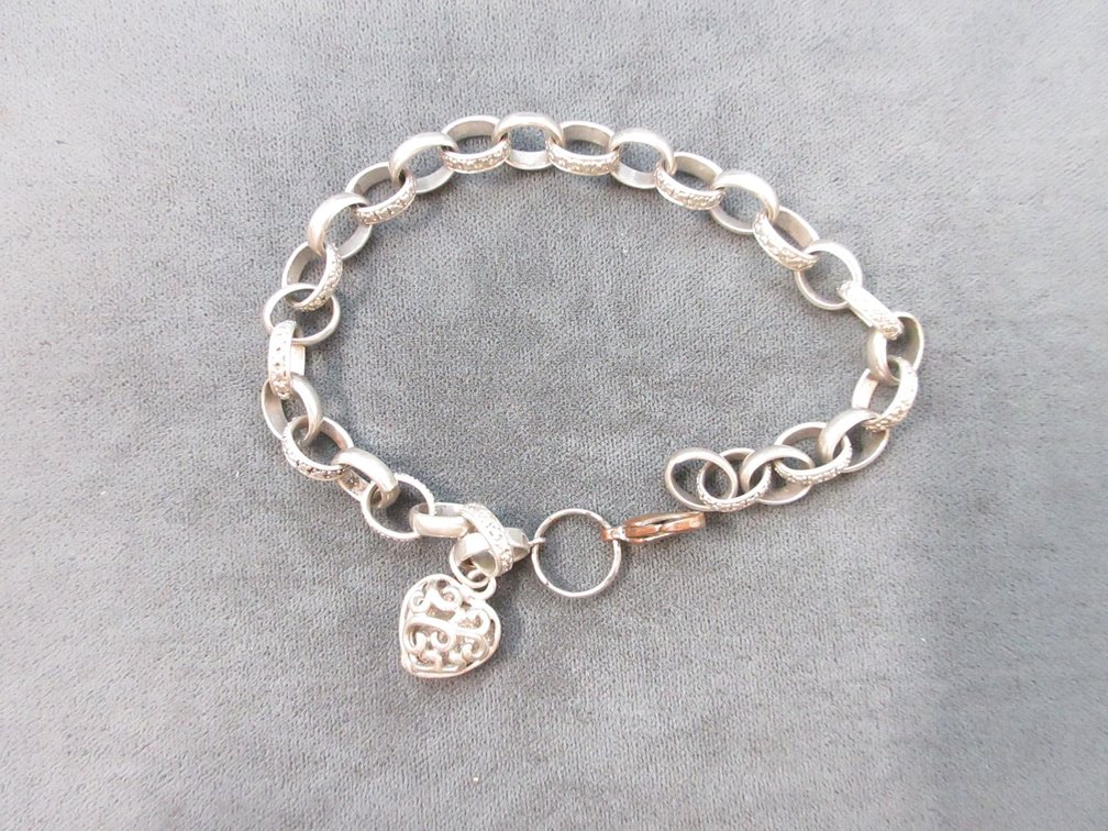 Marked .925 Silver bracelet with heart charm