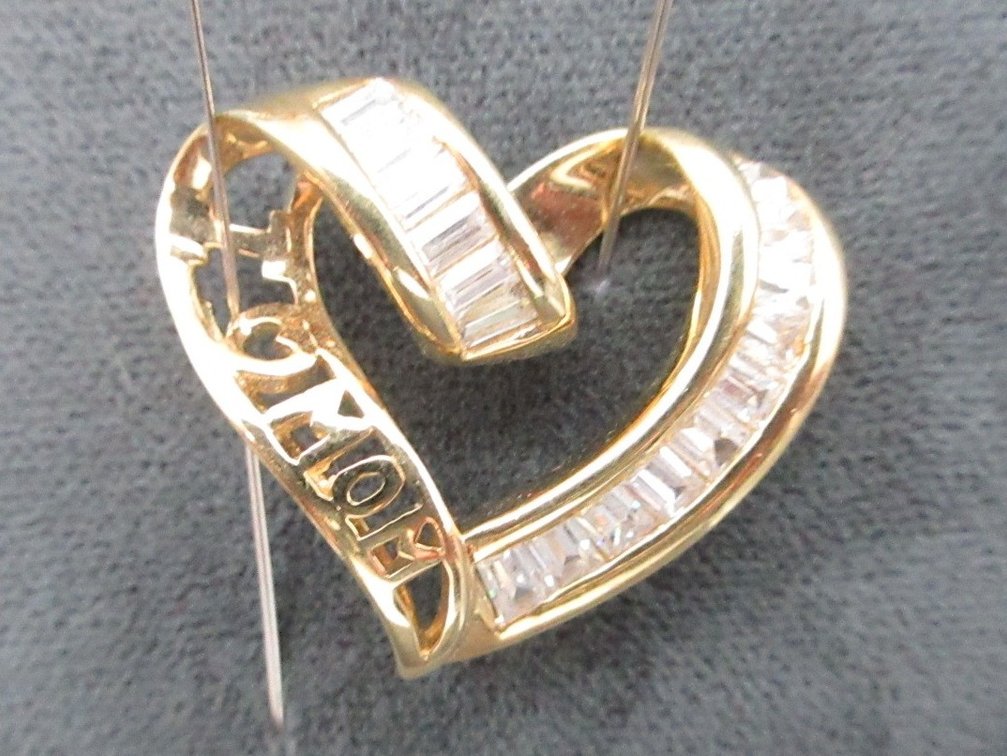 Marked back "MOM" heart pendant with cz baguettes