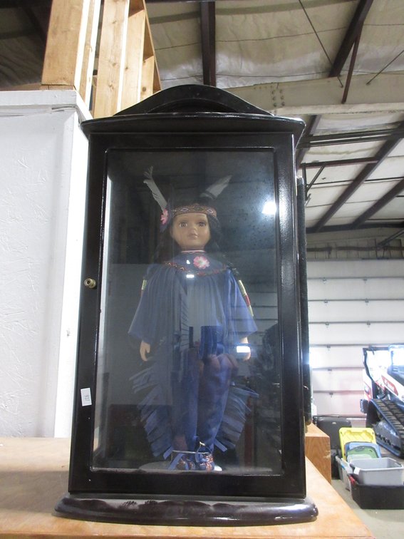 Native American porcelain doll in wood and glass display case
