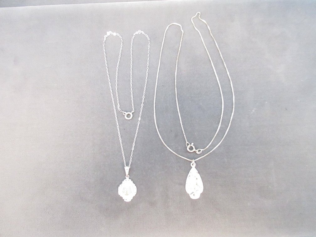 (2) Sterling silver Theda pendants on chains