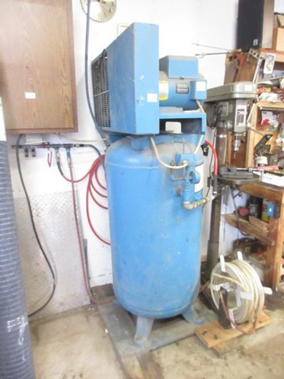 Compair upright air compressor (air hose reel not included)