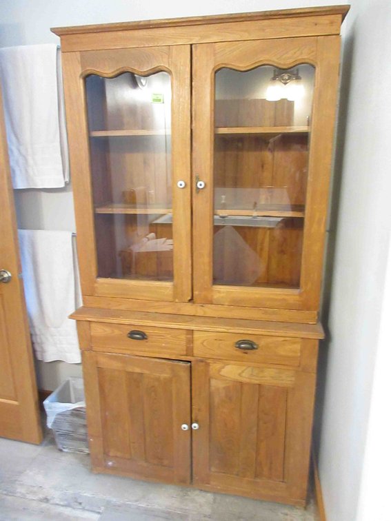 Antique wood cupboard with glass door top