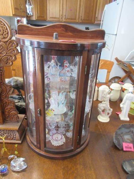 Wood curio case with assorted string glass figures