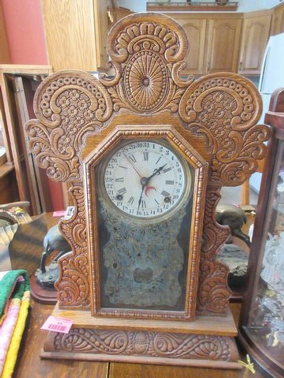 Ingraham shelf clock with heavily carved detail