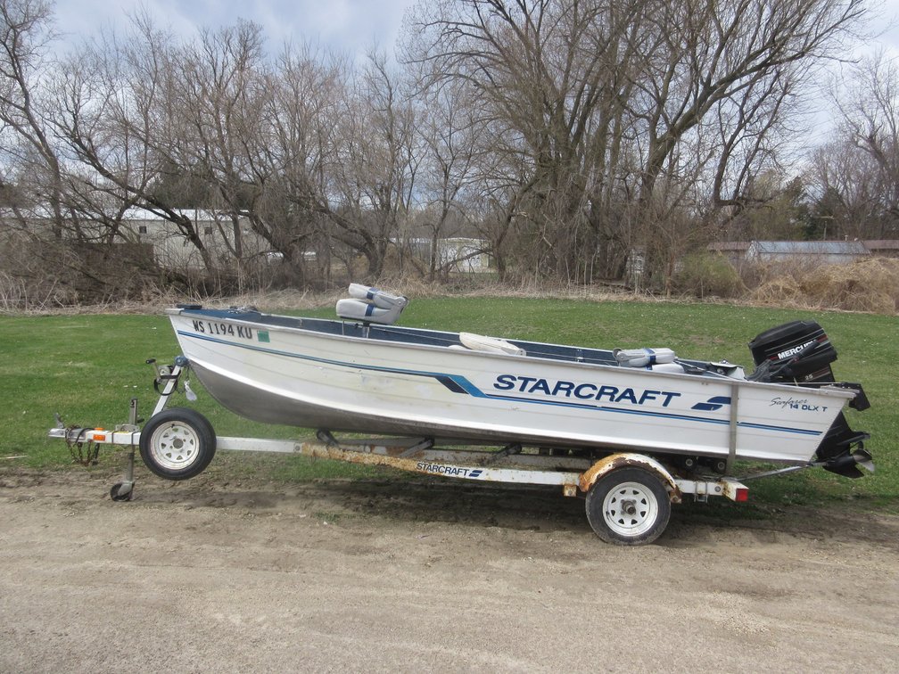 1995 StarCraft boat on trailer, with controls and trolling motor