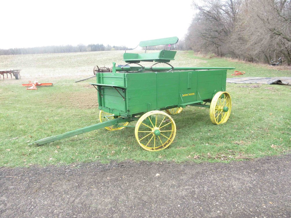 Antique horse drawn 4-wheel wagon with wood box