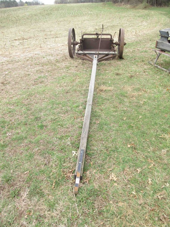 Antique horse drawn dirt bucket on transport