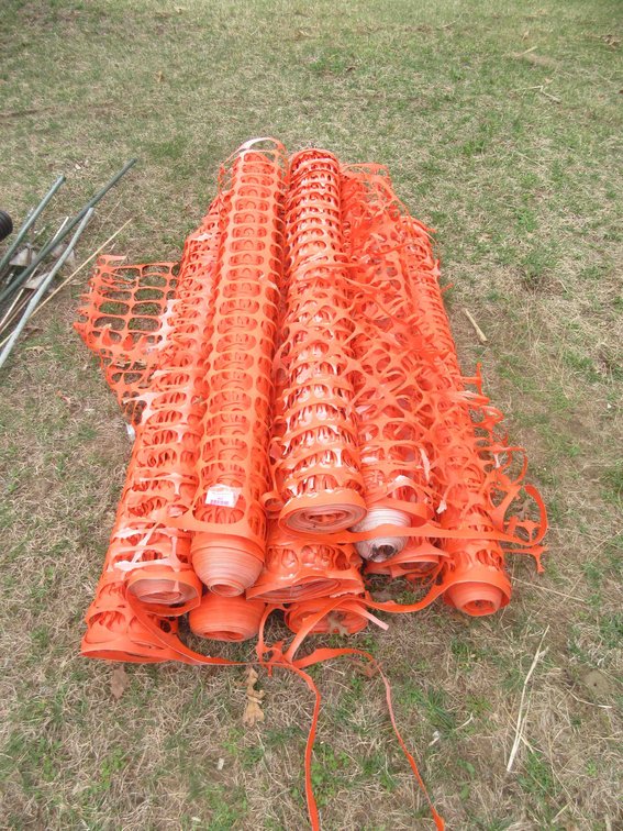 Rolls of orange snow fencing