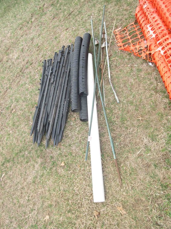 Group of plastic fence posts and tubing