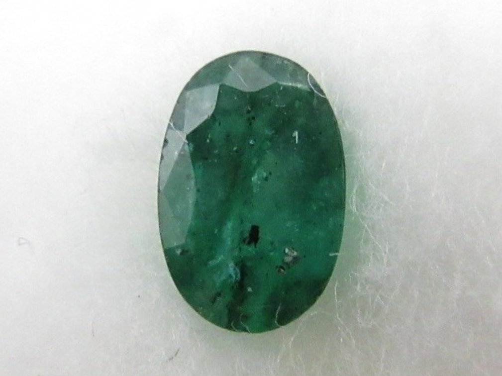 Precious oval green emerald stone