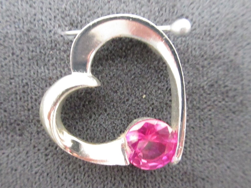 Sterling silver heart pendant with pink sapphire accent