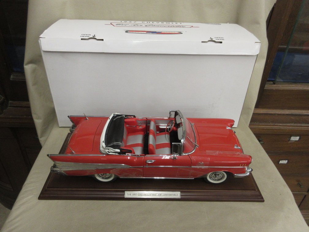 Danbury Mint 1957 Chevrolet Bel Air Convertible model on display stand