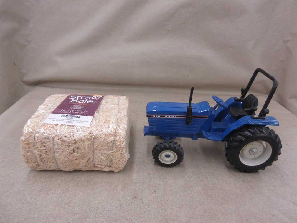 Ertl die cast Ford 1920 toy tractor with 5" straw bale