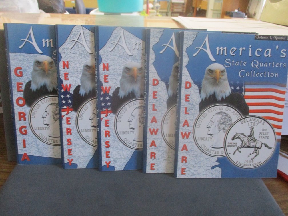 (5) America's State Quarters folders with coins