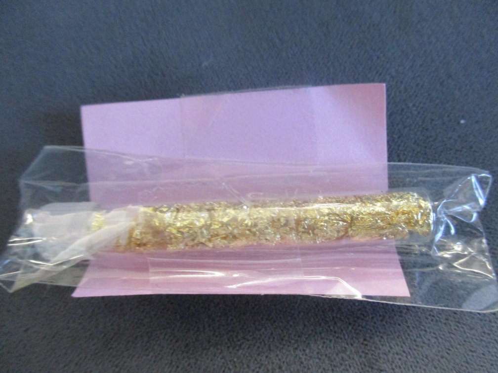 Small vial of gold flake