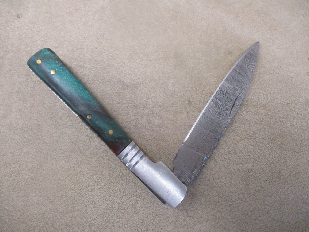 Hand forged Damascus steel pocket knife with leather sheath