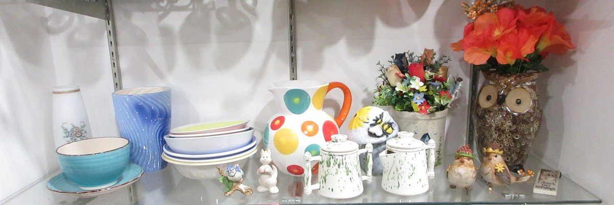 Shelf of bowls, vases, and figurines