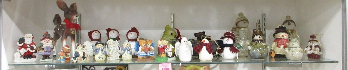 Shelf of snowman figurines