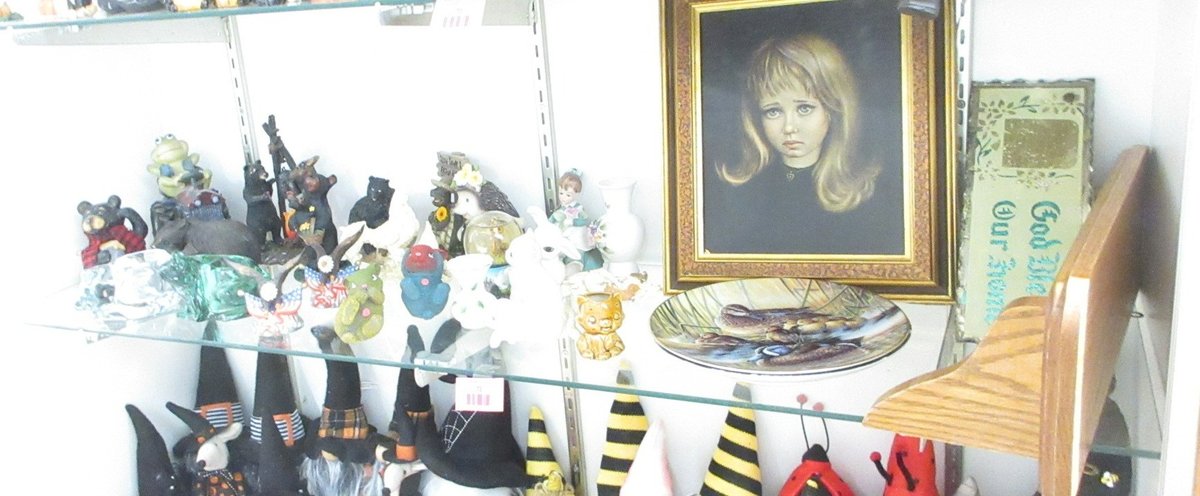 Shelf of figurines and household decoration