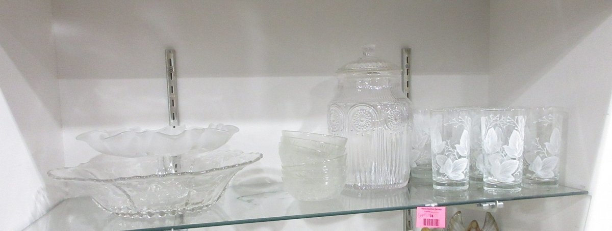 Shelf of clear glassware