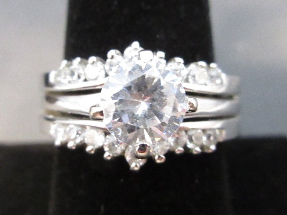 Marked .925 cz solitaire ring with double-row jacket