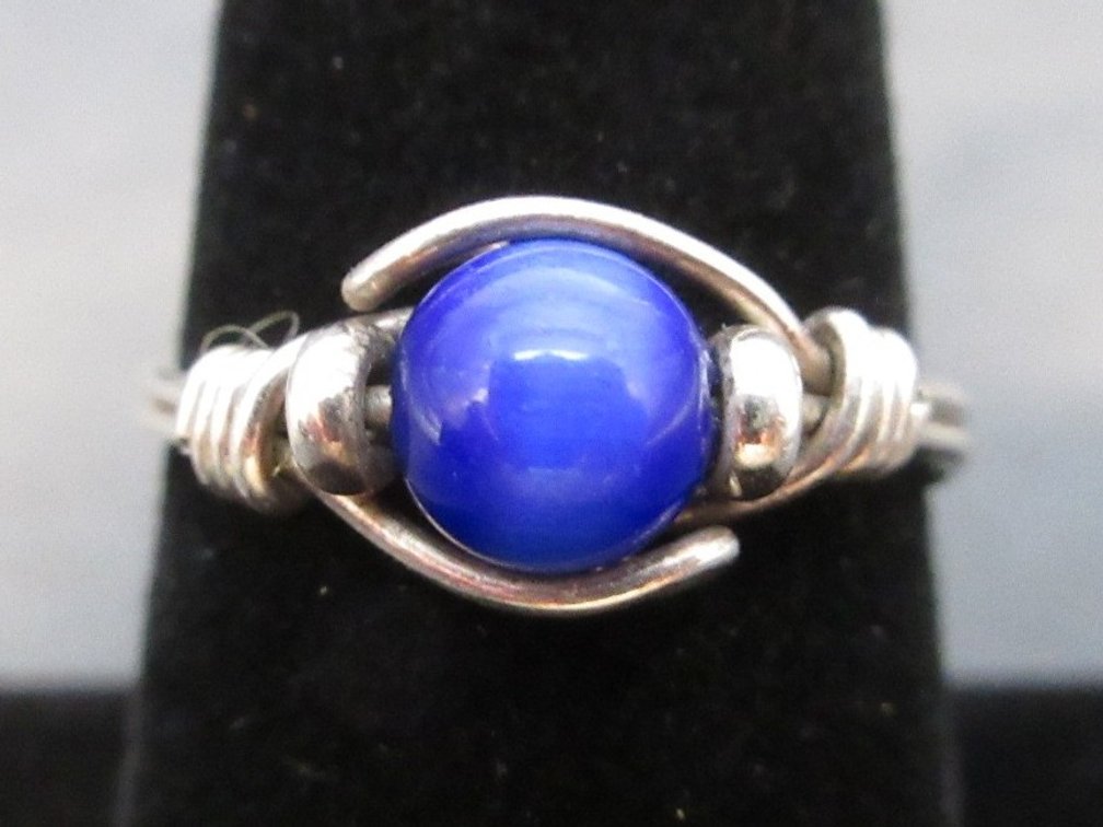 Unmarked silver color wire ring with blue tiger eye stone