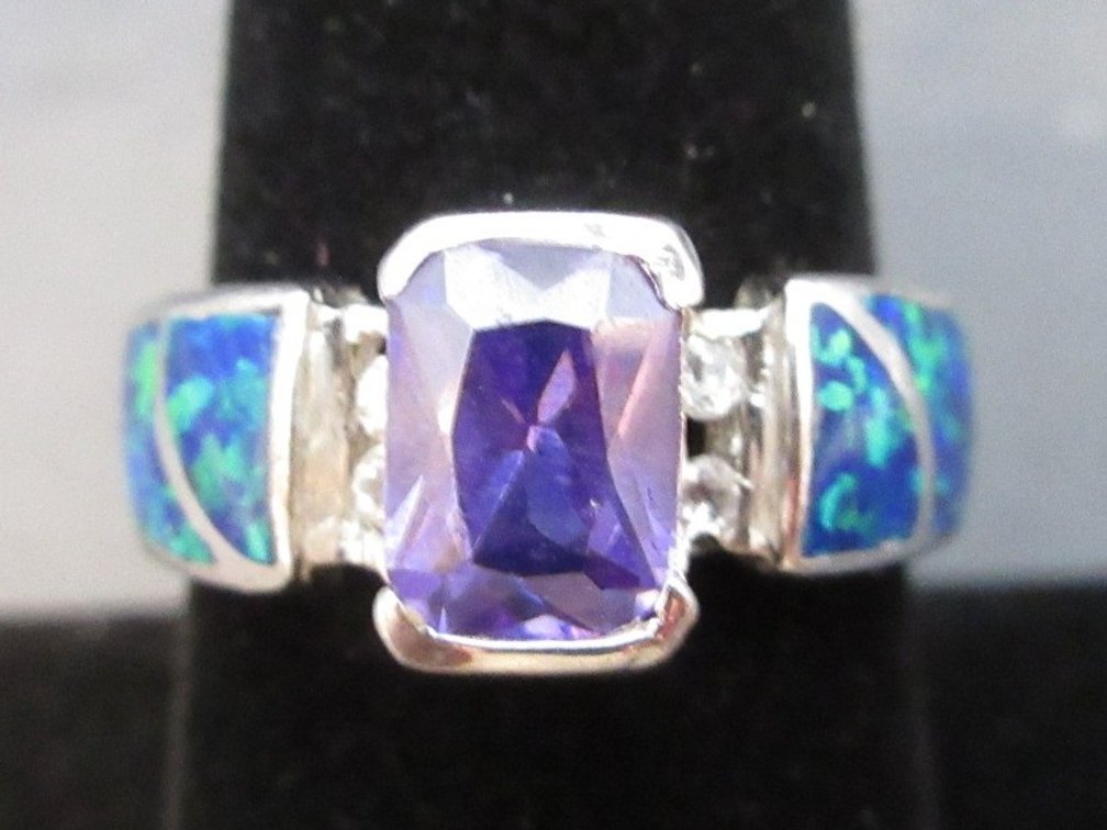 Marked AK .925 sterling ring with purple stone and blue opal inlay